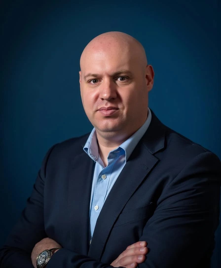 Joel R Klemmer studio profile portrait with graphite background